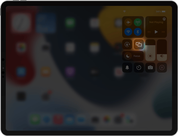 iPad control center with screen mirroring icon highlighted